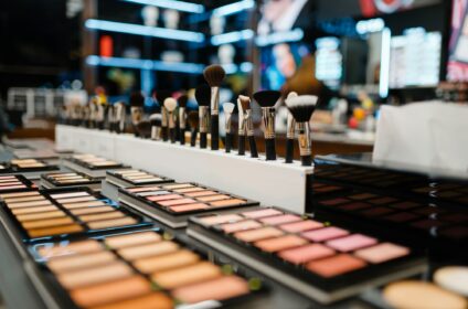 Showcase with powder and shadows, cosmetics store